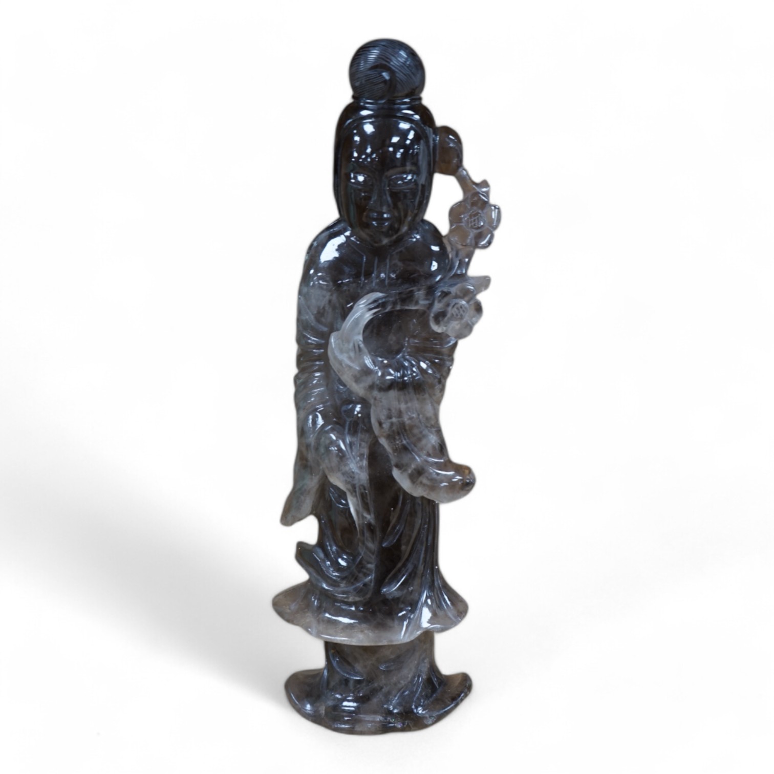 A Chinese smoky quartz figure of Guanyin, 23cm. Condition - fair to good